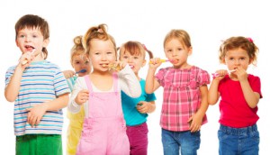Group of kids brushing their teeth